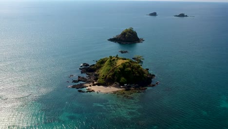 wide aerial shot of small filipino islands of nacpan beach, el nido , palawan, philippines