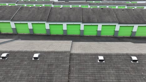 aerial flyover roofs of rental garage units in american suburb district