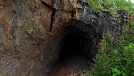 Ascending-shot-of-Tonnes-cave-in-Helgeland,-cave-in-the-mountain,-Northern-Norway,-Nordland