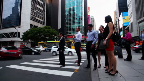 busy city intersection with people crossing