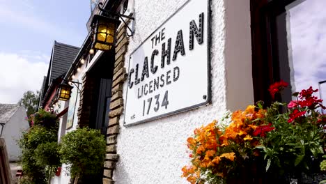 charming pub facade with vibrant floral display