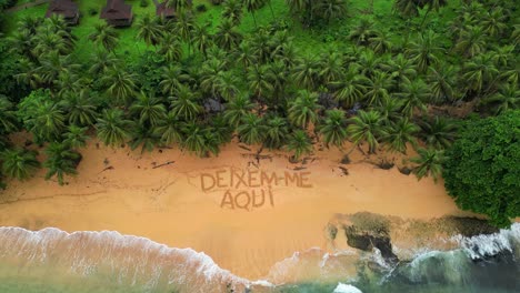 aerial view of a beach, with the inscription in the sand deixem me aqui ( leave me here),africa,sao tome e principe
