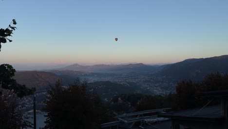 hot air balloon over the alps in como, italy