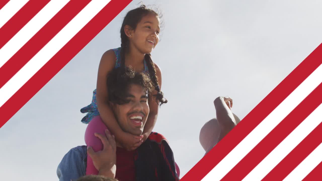animación de la bandera de los estados unidos de américa sobre un padre biracial que lleva a su hija a hombros