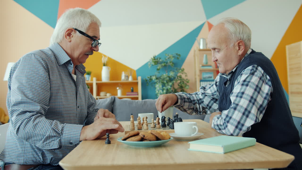 Elderly Men Playing Chess at Home