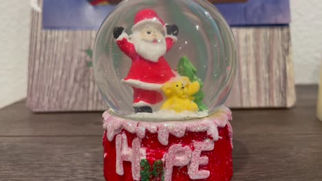 Santa-snow-globe-that-says-"HOPE".-Christmas-decorations