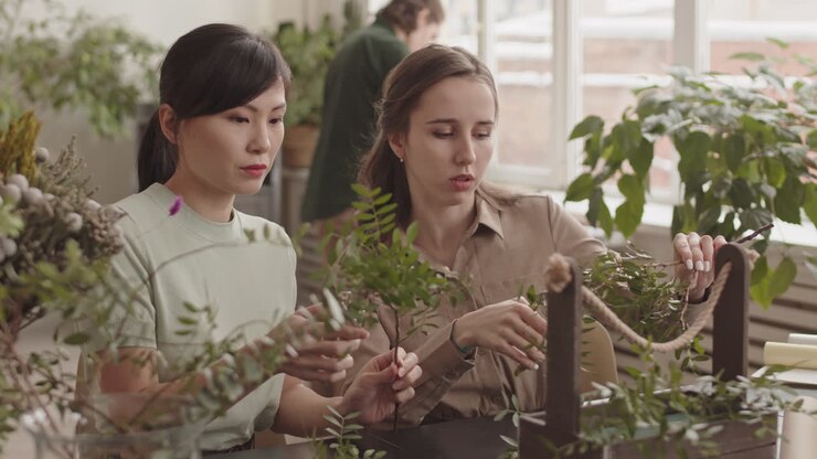 Women learning floral design workshop