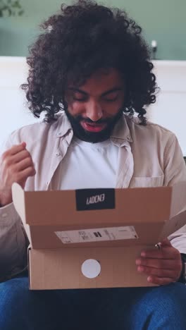 excitement unfolds as a gift box opens in a cozy living room