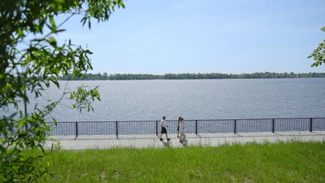 couple walking along riverwalk