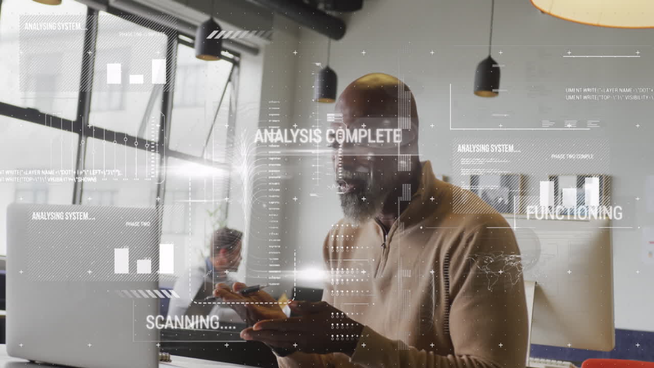 Animation of graphs, texts, computer language over african american man working on laptop in office