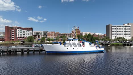 Experience-the-marvels-of-marine-science-with-this-captivating-aerial-footage-of-an-ocean-research-ship-gracefully-navigating-a-tranquil-river