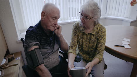 senior man getting his blood pressure checked