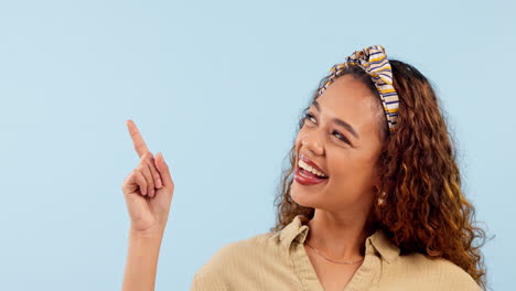 Mockup,-pointing-and-face-of-happy-woman-in-studio