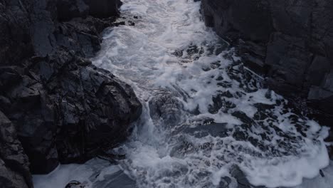 tidal waves rolling into canyon at sunset