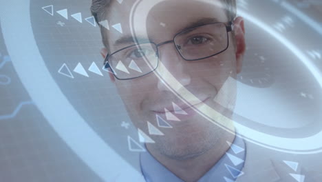 smiling man with glasses interacting with animation on futuristic digital interface