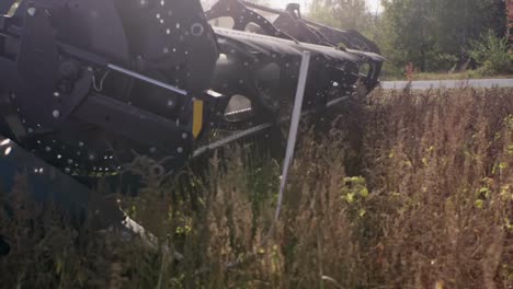 Combine-harvester-harvesting-organic-soybeans-on-sunny-day-slow-motion