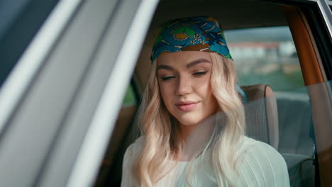 woman in a vintage car