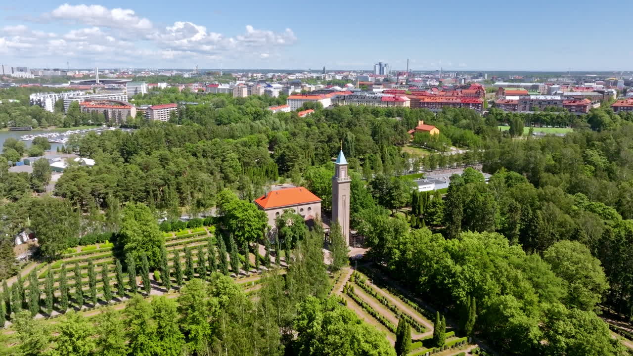 Aerial view descending in front of the Hietaniemi chapel, summer day in Helsinki