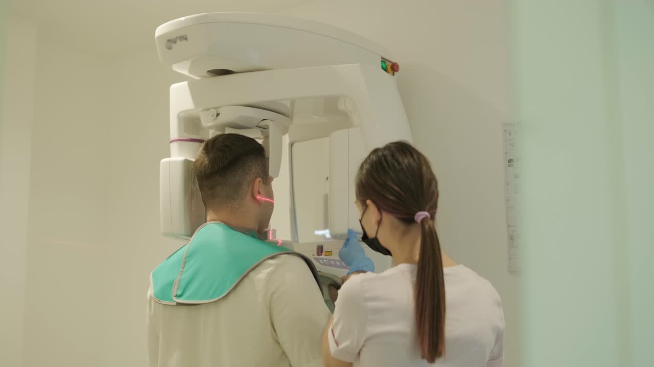 Patient Undergoing Dental X-Ray with Technician