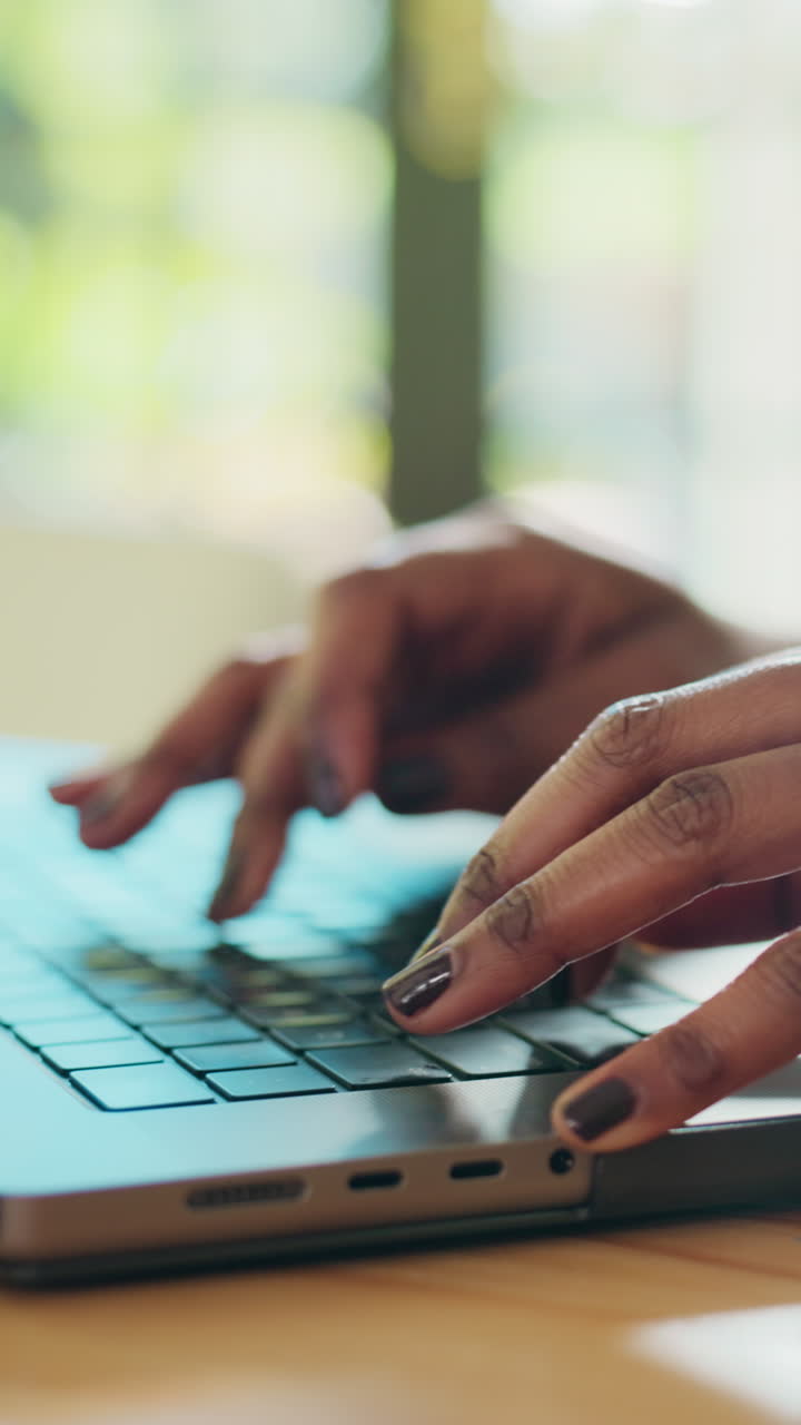 Close-Up of Hands Typing on Laptop Keyboard