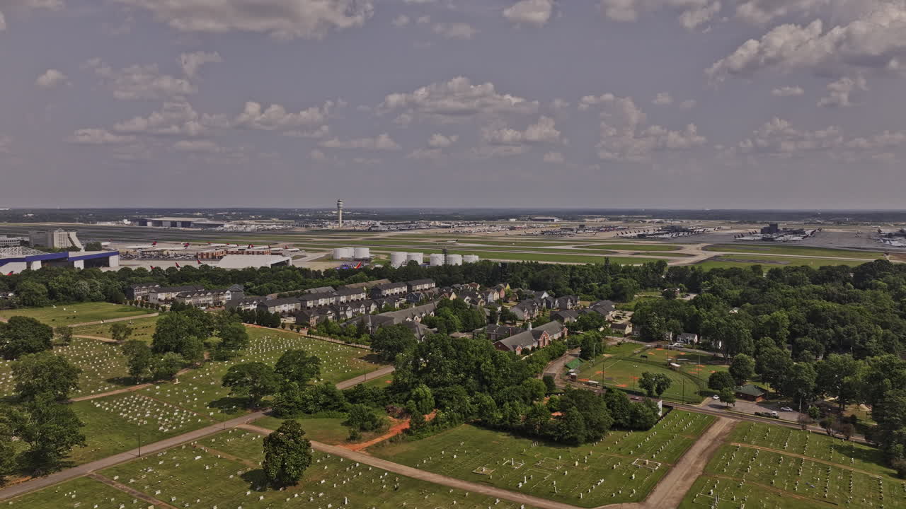 Atlanta Georgia Aerial v961 drone flyover College Park Cemetery towards Delta North Hangar capturing ATL Hartsfield Jackson International Airport at daytime - Shot with Mavic 3 Pro Cine - June 2023
