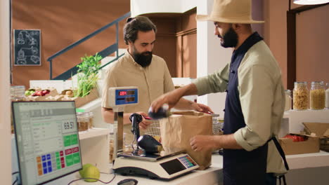 store owner serving client with produce