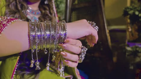 close up of a hand of a beautiful asian bride having bangles and rings