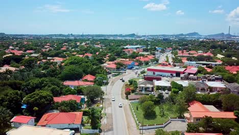 Aerial-dolly-in-view-of-the-traffic-on-the-streets-of-Mahaai-Buurt,-Willemstad,-Curacao,-Dutch-Caribbean-island