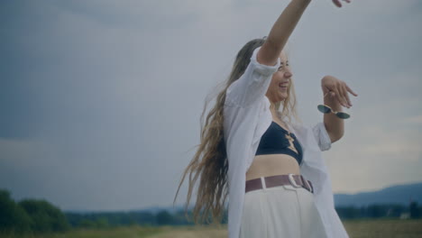 Joyful-Woman-Dancing-Outdoors