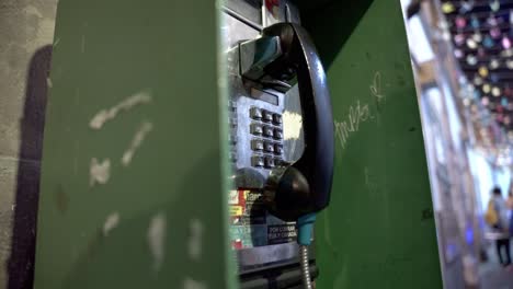 old tech payphone booth in downtown