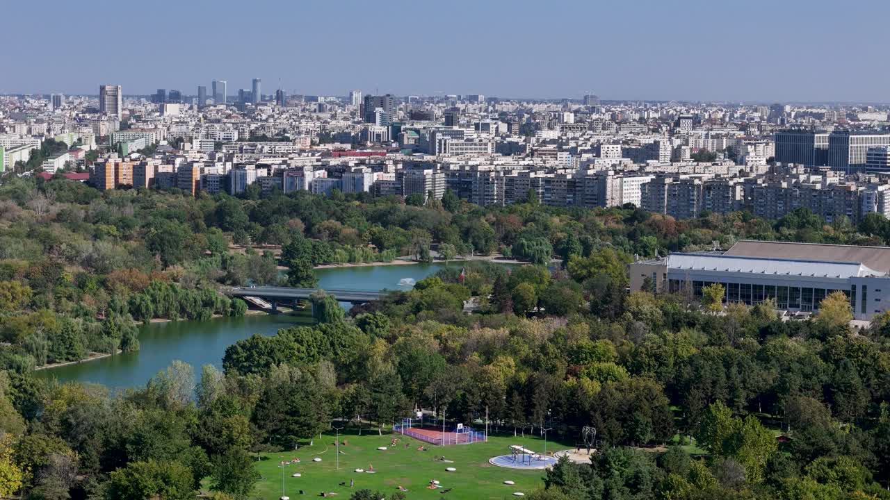 Aerial View of Bucharest, Romania: Cityscape, Park, and Lake