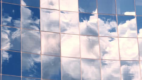 reflection of clouds in modern building windows