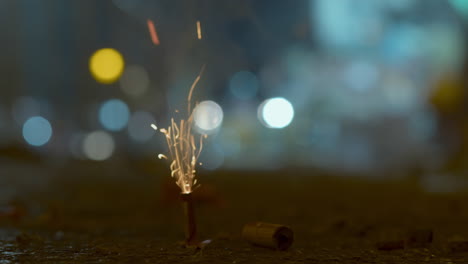 a firecracker is set on fire on a city street