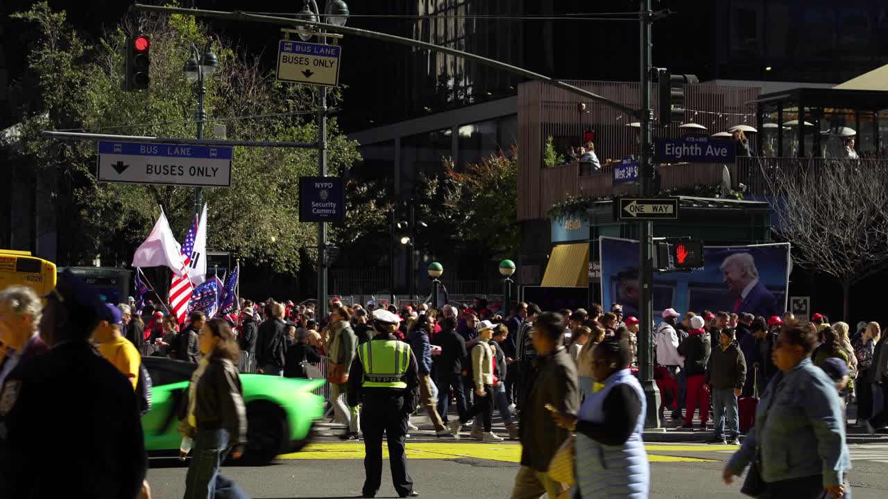 Crowds of people converge near Madison Square Garden, their support for Trump clear as they stand together in the sunlit streets