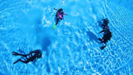 scuba divers training in a pool