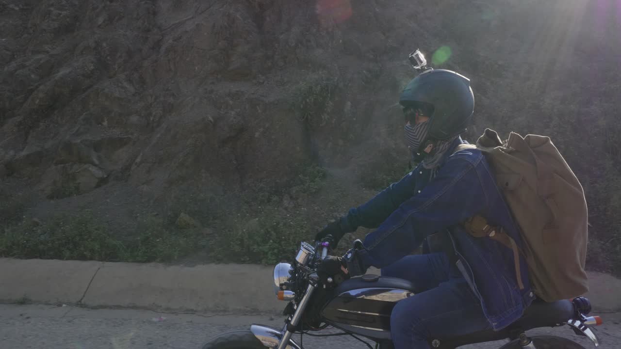 Motorcyclist on a scenic dirt road journey