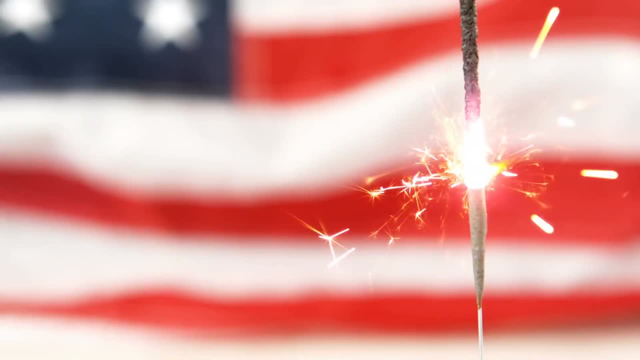 United States text and an American flag with a sparkle for fourth of July.