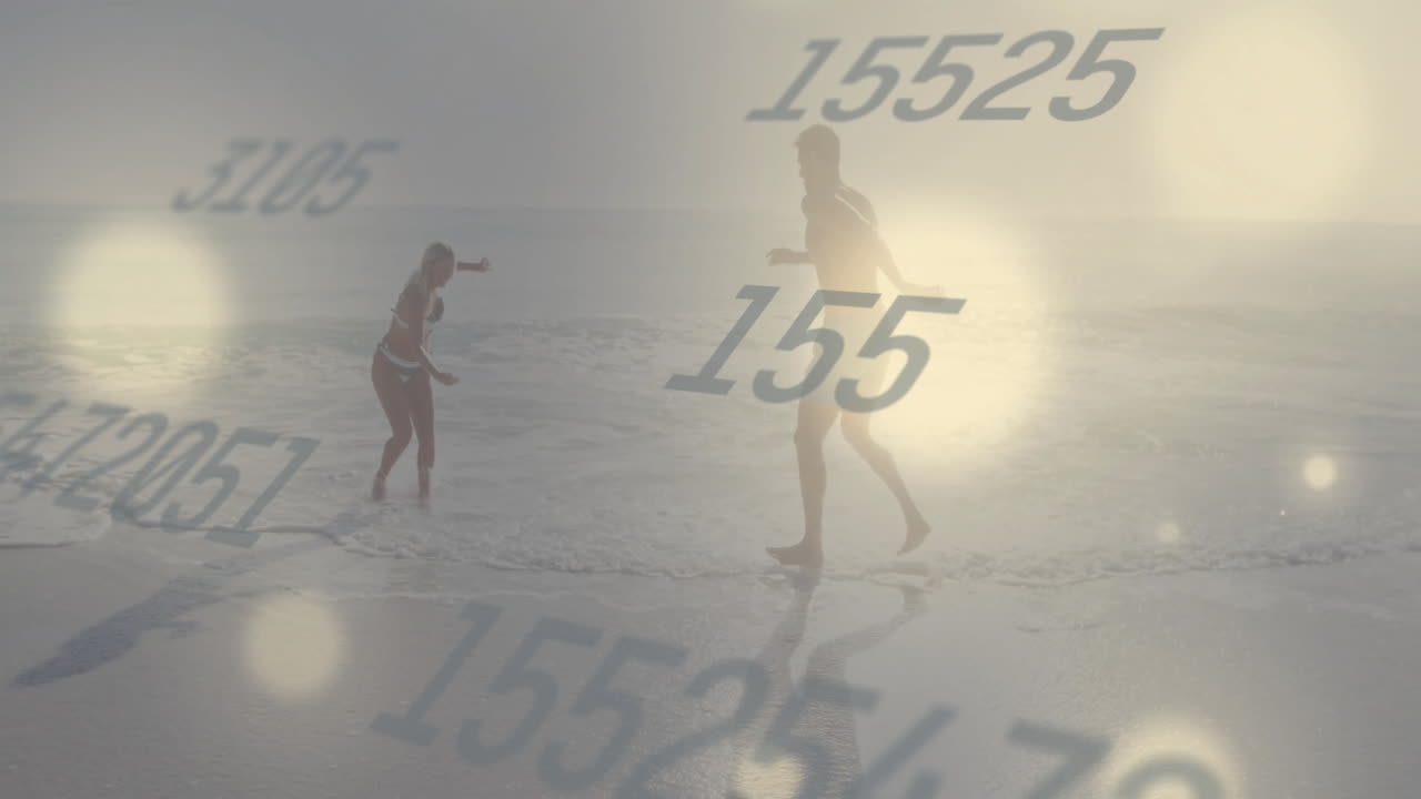 Playing on beach, people surrounded by animation of numbers and light effects