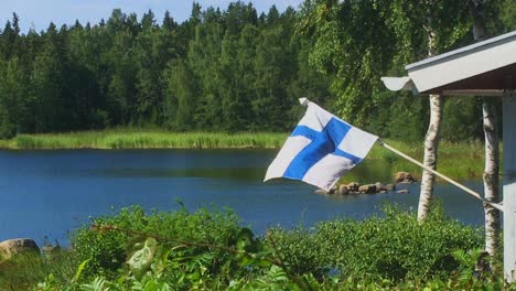 flag of finland waving at the summer cottage, holiday vacation vibe