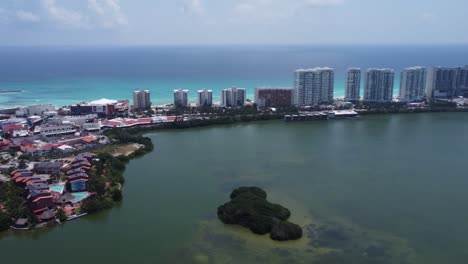 aerial tour of cancun hotel zone with blue caribbean sea and nichupte lagoon, mexico