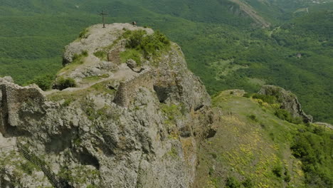 Majestic-scenery-of-the-Azeula-Fortress-and-a-cross-against-a-broad-wilderness