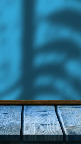 animación de hojas y sombras de ventanas sobre fondo azul y de madera