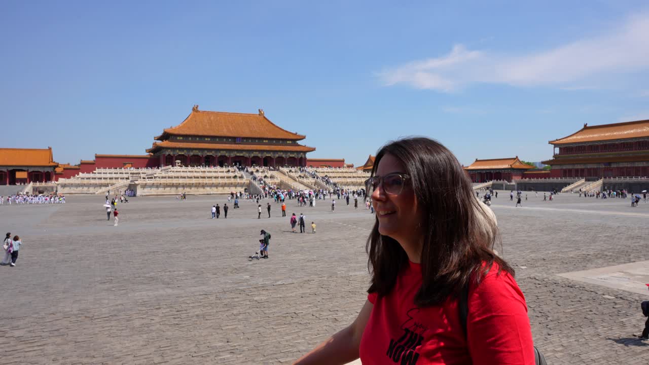 Caucasian tourist woman admiring Forbidden City traditional architecture. Slowmo