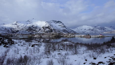 low aerial revealing shot on a scenic winter day, sildpollnes in lofoten, norway