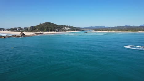 jet skiing at currumbin beach next to palm beach in summer - currumbin rock in queensland, australia. - aerial shot