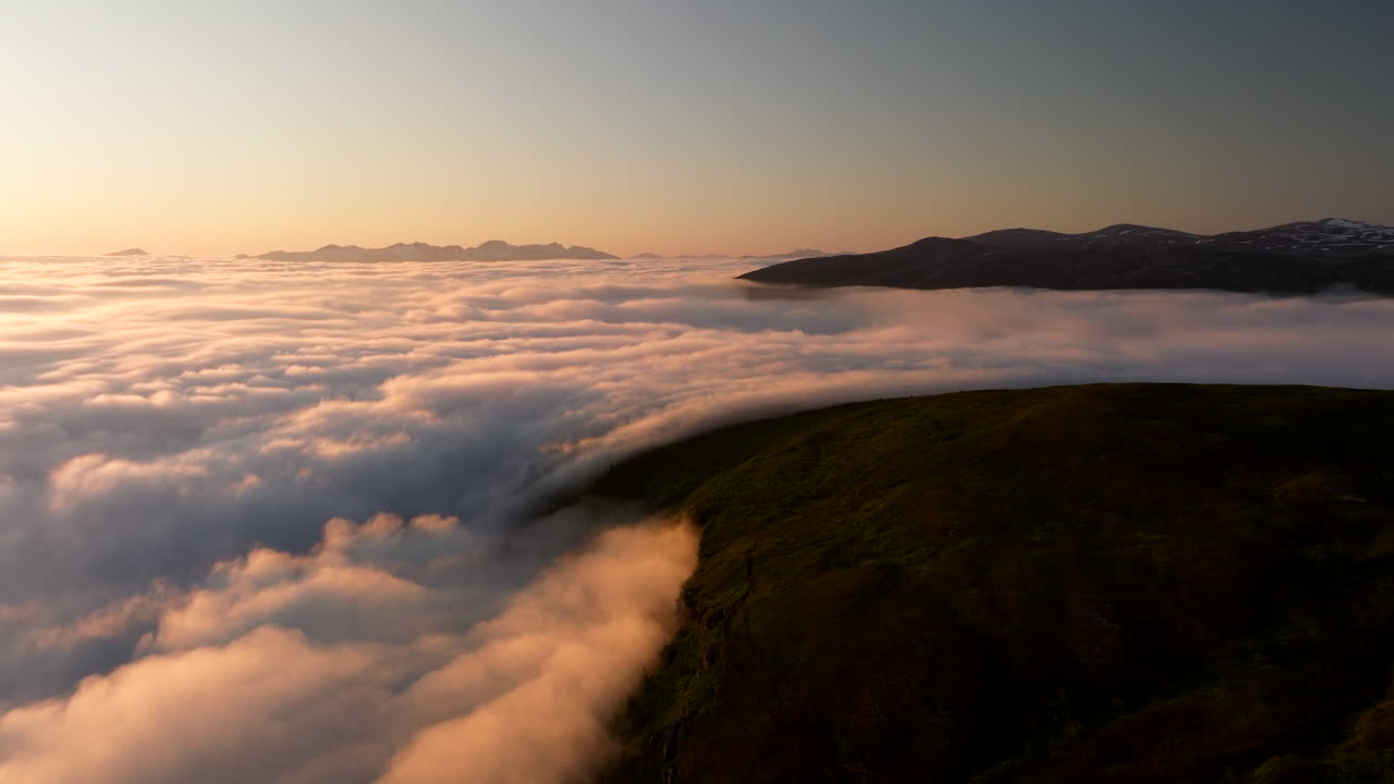 Sea fog under midnight sun, Tromsø, Norway. Aerial drone panoramic view