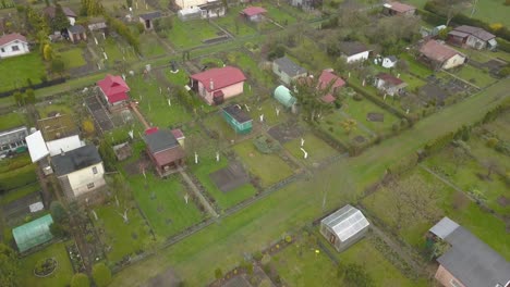 aerial-of-allotment-gardening-in-residential-area-of-the-city,-smart-metropolitan-green-development