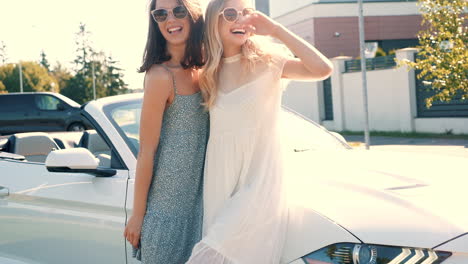 two friends enjoying a sunny day in a convertible