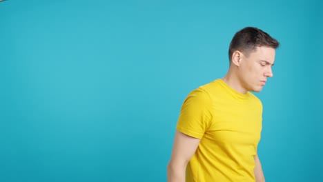 Man with hand raised in stop gesture
