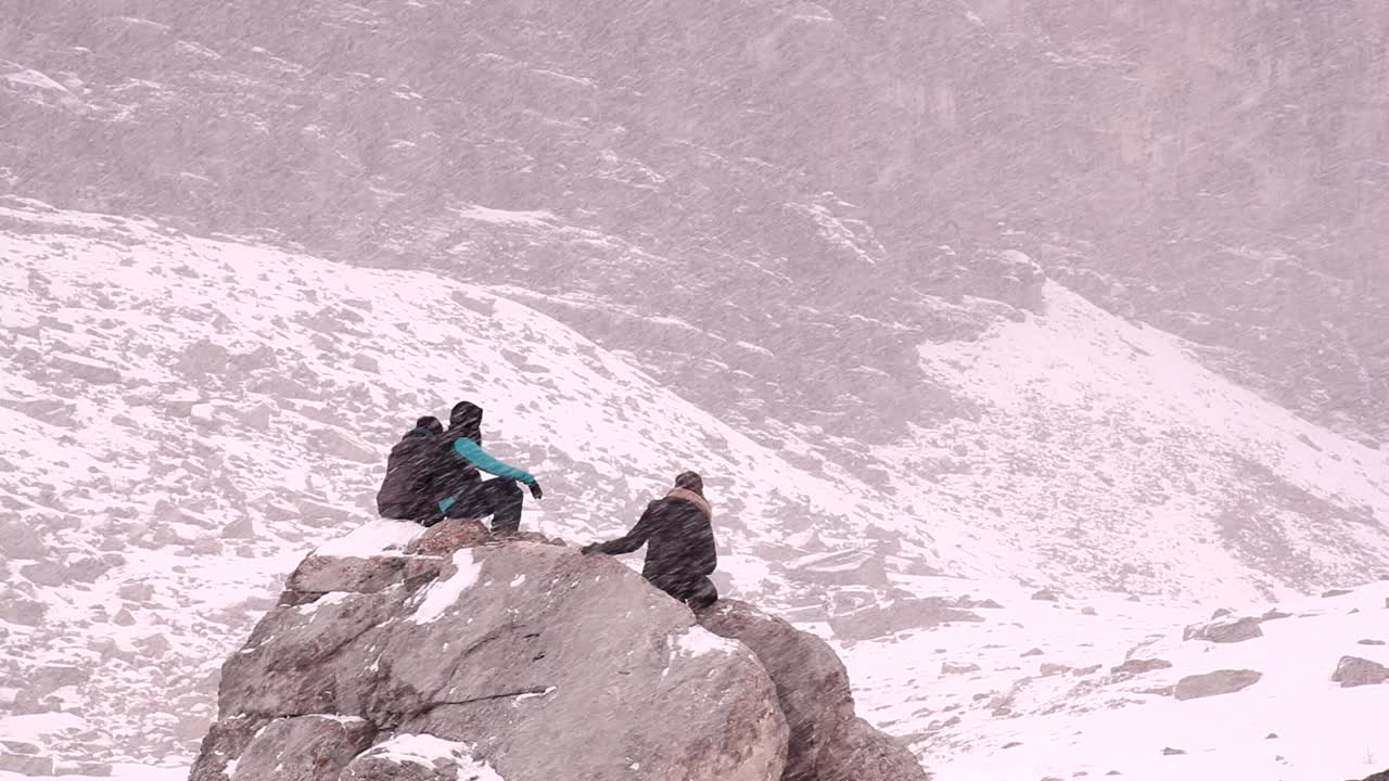 Hikers resting on a hike.rock